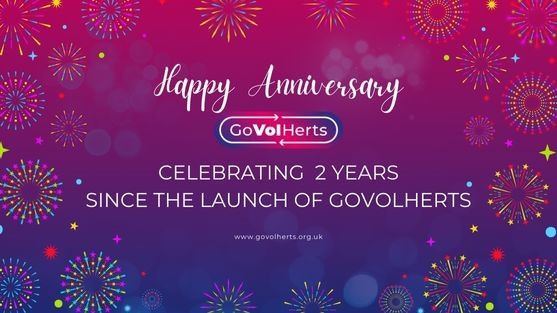 Pink and purple design with white text and fireworks, GoVolHerts logo and text "Happy Anniversary", "Celebrating 2 Years Since the launch of GoVolHerts", www.govolherts.org.uk