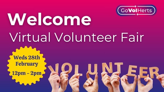 Pink and blue background with text Welcome Virtual Volunteer Fair. GoVolHerts logo is top right. Yellow Star bottom left with date and time. Image at bottom of white people's hands holding up letters which spell Volunteer