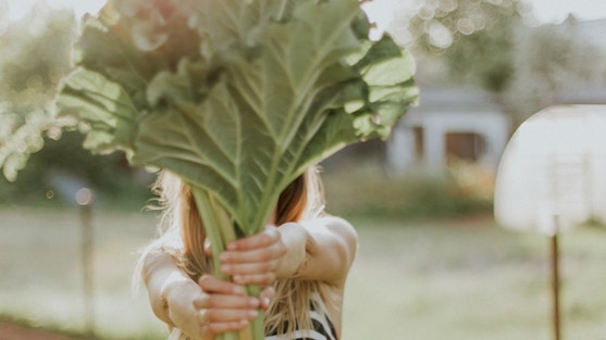 woman holding kale